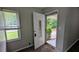 Inviting entryway showcasing a decorative front door, window, and neutral paint color at 1091 Luther Sw Dr, Mableton, GA 30126
