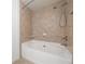 Bathroom features a shower, tub, and tiled walls at 1468 Briarwood Ne Rd # 2003, Atlanta, GA 30319