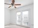Bright bedroom features a ceiling fan, and double doors open to a balcony at 1468 Briarwood Ne Rd # 2003, Atlanta, GA 30319