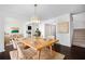 Open dining room with hardwood floors, neutral décor, and view into the living room and kitchen at 1468 Briarwood Ne Rd # 2003, Atlanta, GA 30319