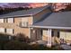 Charming home with a balcony, red door, black shutters, and inviting front entrance with sitting area at 1468 Briarwood Ne Rd # 2003, Atlanta, GA 30319