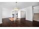 This open-concept living room boasts hardwood floors and an open view to the staircase at 1468 Briarwood Ne Rd # 2003, Atlanta, GA 30319