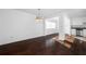 Bright open-concept living room featuring gleaming dark hardwood floors and ample natural light at 1468 Briarwood Ne Rd # 2003, Atlanta, GA 30319