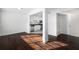 Open-concept living room boasts hardwood floors and an open view to the kitchen at 1468 Briarwood Ne Rd # 2003, Atlanta, GA 30319
