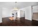 Inviting living room with hardwood floors, white walls and staircase to upper level at 1468 Briarwood Ne Rd # 2003, Atlanta, GA 30319