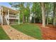 Large backyard featuring a stone pathway leading to the porch at 1768 San Andra Dr, Marietta, GA 30062