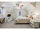 Bedroom with a ceiling fan, desk area, and window for natural light at 1768 San Andra Dr, Marietta, GA 30062
