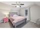 Comfortable bedroom with a ceiling fan, natural light and a pink bedside table at 1768 San Andra Dr, Marietta, GA 30062