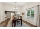 Open-concept dining room with access to kitchen, living area and backyard at 1768 San Andra Dr, Marietta, GA 30062