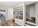 Bright entryway with hardwood floors, decorative mirror, bench seating, and staircase to the upper level at 1768 San Andra Dr, Marietta, GA 30062