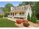 Charming home with a cozy front porch, colorful plants, and inviting curb appeal at 1768 San Andra Dr, Marietta, GA 30062