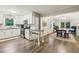 Modern kitchen featuring white cabinets, granite countertops, stainless steel appliances, and hardwood floors at 1768 San Andra Dr, Marietta, GA 30062