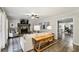 Inviting living room with stone fireplace, ceiling fan, and modern furnishings with view into adjacent dining area at 1768 San Andra Dr, Marietta, GA 30062