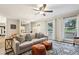 Bright living room with hardwood floors, large windows, and modern decor, creating a welcoming space at 1768 San Andra Dr, Marietta, GA 30062