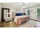 Serene main bedroom with accent pillows, natural light and decorative accents at 1768 San Andra Dr, Marietta, GA 30062