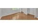 This bedroom features wood-look flooring and an easily accessible closet at 4440 Coventry Ne Ct, Roswell, GA 30075