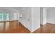 Bright living room featuring hardwood floors, a door to a deck, and neutral paint at 4440 Coventry Ne Ct, Roswell, GA 30075