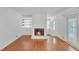Bright living room with hardwood floors, a fireplace and access to an outdoor deck at 4440 Coventry Ne Ct, Roswell, GA 30075