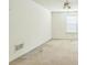 Simple bedroom with ceiling fan, carpeted floor, and a window at 745 Birchberry Sw Ter, Atlanta, GA 30331