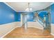 Dining area featuring hardwood floors and staircase at 745 Birchberry Sw Ter, Atlanta, GA 30331