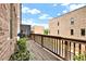 Cozy balcony featuring wooden deck, brick facade, and tranquil views of surrounding buildings at 1626 Aldworth Se Pl, Atlanta, GA 30339