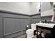 Powder room features gray wallpaper, a stylish vanity, and modern fixtures at 1626 Aldworth Se Pl, Atlanta, GA 30339