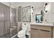 Bathroom showcases modern design, a glass shower, decorative art, and modern fixtures at 1626 Aldworth Se Pl, Atlanta, GA 30339