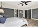 Spacious bedroom featuring elegant color blocking, modern ceiling fan, and en-suite access to the bathroom at 1626 Aldworth Se Pl, Atlanta, GA 30339