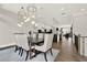 Elegant dining room with modern lighting and hardwood floors, conveniently located off kitchen and living area for easy entertaining at 1626 Aldworth Se Pl, Atlanta, GA 30339