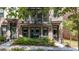 Charming brick townhouse with a cozy balcony and well-maintained landscaping offering curb appeal at 1626 Aldworth Se Pl, Atlanta, GA 30339