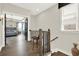 Upstairs hallway with view into a bedroom, dark wood floors, and modern fixtures at 1626 Aldworth Se Pl, Atlanta, GA 30339