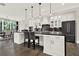 Well-appointed kitchen with an eat-in island, stainless steel appliances, custom cabinetry, and an open layout for modern living at 1626 Aldworth Se Pl, Atlanta, GA 30339