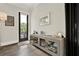 Cozy living area featuring a stylish console table, art, and a view to the balcony at 1626 Aldworth Se Pl, Atlanta, GA 30339