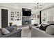 Stylish living room with a cozy fireplace, built-in shelves, and comfortable seating area at 1626 Aldworth Se Pl, Atlanta, GA 30339