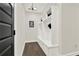 Mudroom includes built-in storage, a bench, and stylish lighting with wood floors at 1626 Aldworth Se Pl, Atlanta, GA 30339