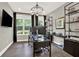 Beautiful office with modern lighting, a sleek glass desk, large windows, and custom shelving at 1626 Aldworth Se Pl, Atlanta, GA 30339
