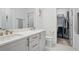 Elegant bathroom with double vanity, quartz countertops, and a spacious closet at 230 New St # 2102, Decatur, GA 30030