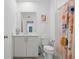 Bright bathroom featuring a single vanity and colorful shower curtain at 230 New St # 2102, Decatur, GA 30030