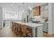 Modern kitchen with white countertops, stainless steel appliances, pendant lighting, and wood floors at 230 New St # 2102, Decatur, GA 30030