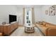 Bright living room featuring modern furnishings and a balcony with outside views at 230 New St # 2102, Decatur, GA 30030