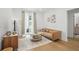 Cozy living room featuring modern decor, hardwood floors, and a balcony at 230 New St # 2102, Decatur, GA 30030