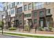 Charming townhomes with brick facades, private entrances, and manicured landscaping on a quiet street at 230 New St # 2102, Decatur, GA 30030