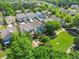 Aerial view of a residential neighborhood, highlighting mature trees and green spaces at 3219 Colchester St, Douglasville, GA 30135