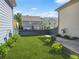 Grassy backyard is surrounded by fence with some landscaping at 3219 Colchester St, Douglasville, GA 30135