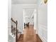 Elegant entryway with hardwood floors, staircase, and view to the living room at 3219 Colchester St, Douglasville, GA 30135