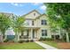 Charming two-story home with a well-manicured lawn and inviting front porch at 3219 Colchester St, Douglasville, GA 30135