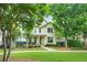 Inviting two-story home with manicured lawn, landscaped with mature shade trees at 3219 Colchester St, Douglasville, GA 30135