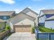 Charming exterior of a two-story home with attached garage, and a concrete driveway at 3219 Colchester St, Douglasville, GA 30135
