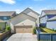 Home featuring a one-car garage with a driveway and small front yard at 3219 Colchester St, Douglasville, GA 30135