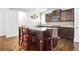 Kitchen featuring granite countertops, an island with seating, and stainless steel appliances at 3219 Colchester St, Douglasville, GA 30135